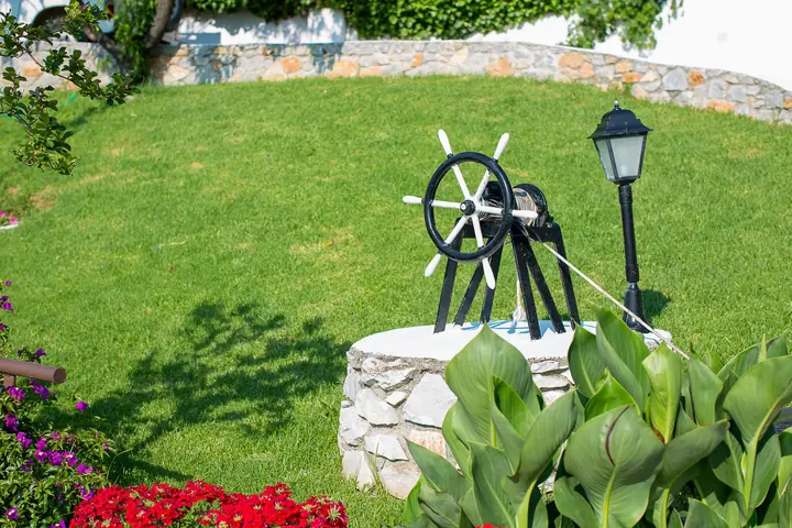 A ship's wheel in the garden