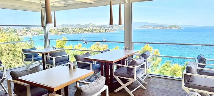 Tables on the terrace above the sea